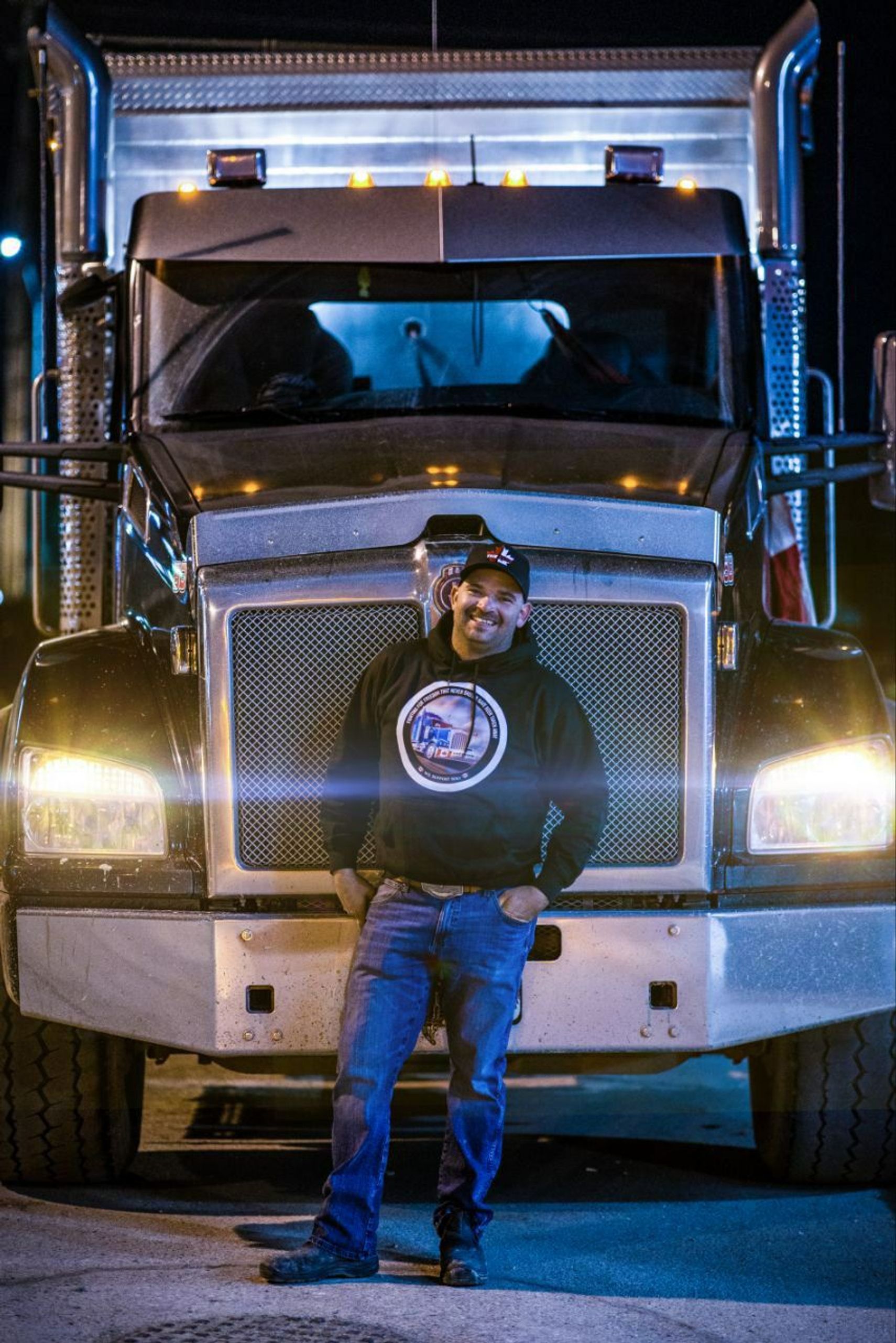 Image of Ken Wales standing in front of his semi truck.